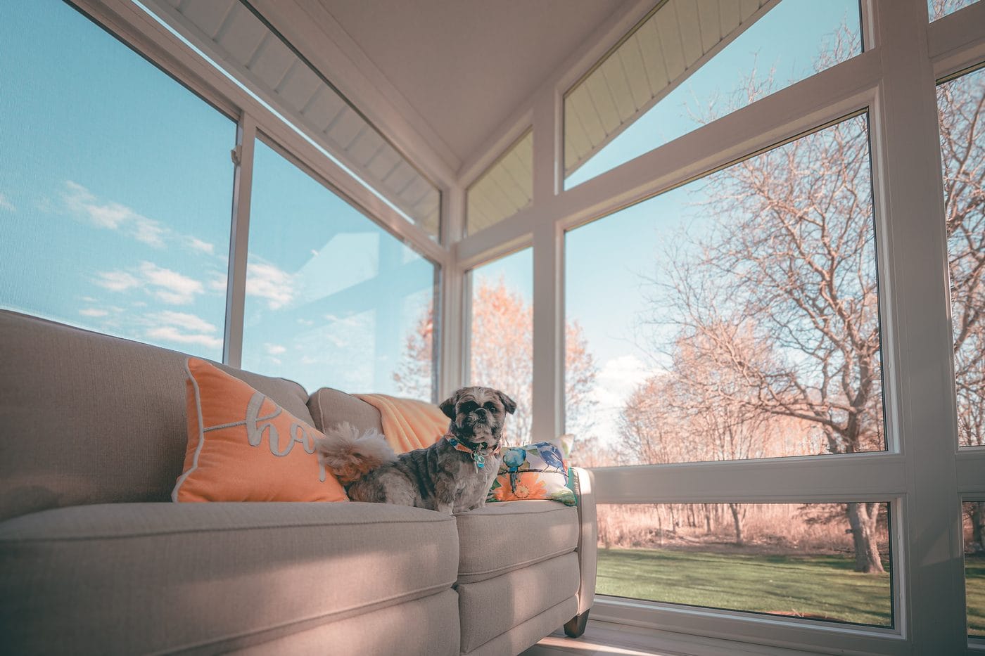 Three-season sunroom with large glass panels in South Jersey.