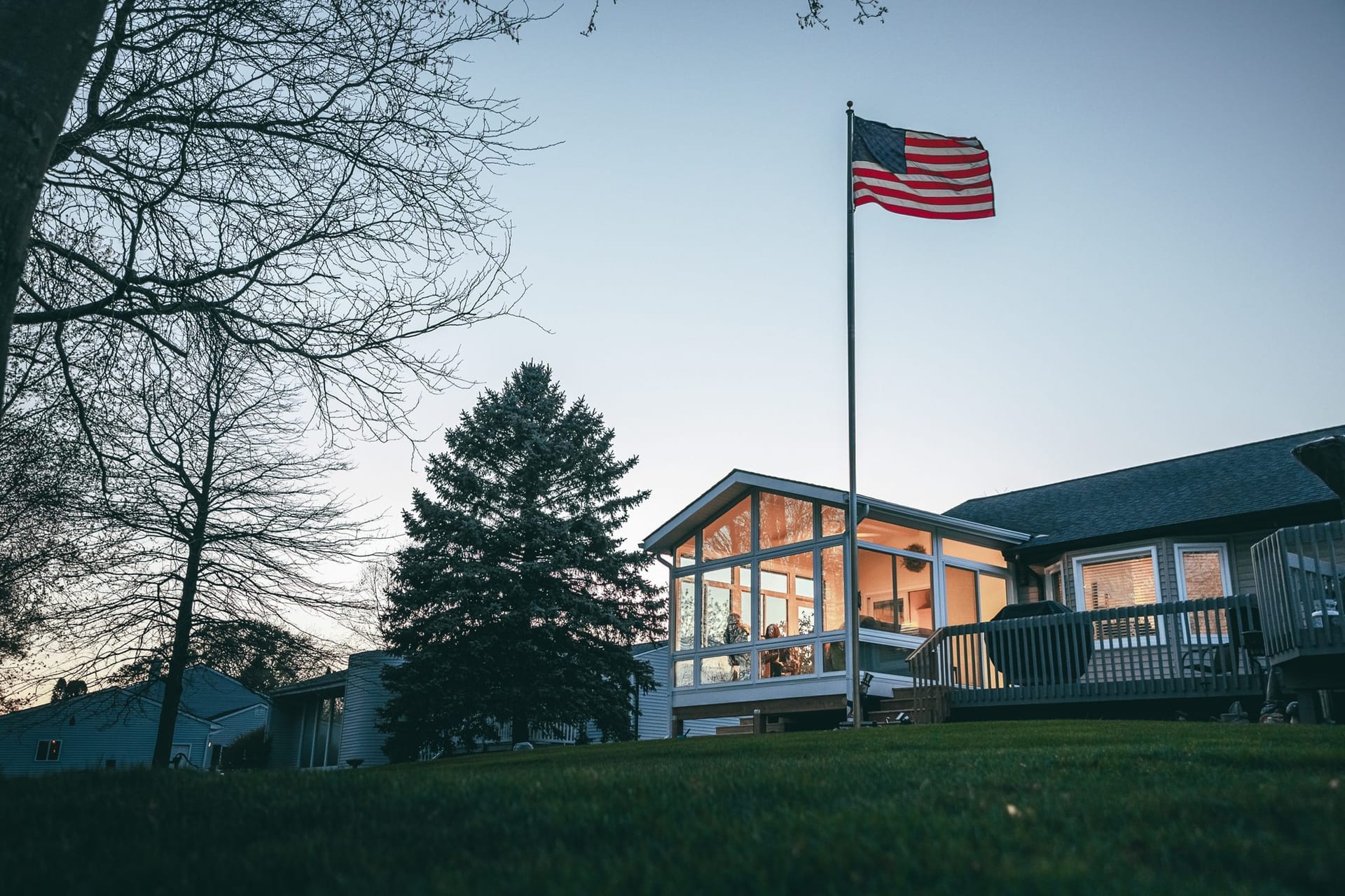 Finished outdoor living space in a South Jersey residential setting with a subtle American flag visible in the background
